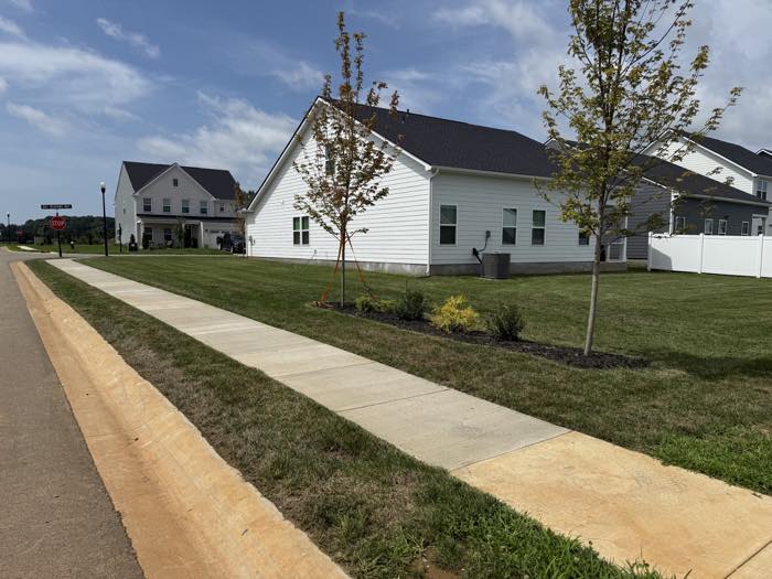Clean sidewalk lines and fresh landscaping