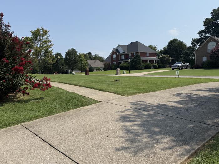 Corner lot mowed and edged to the sidewalk